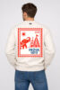 Men's off-white crewneck sweatshirt with large red and blue INDIA BHARAT postage stamp graphic on the back.