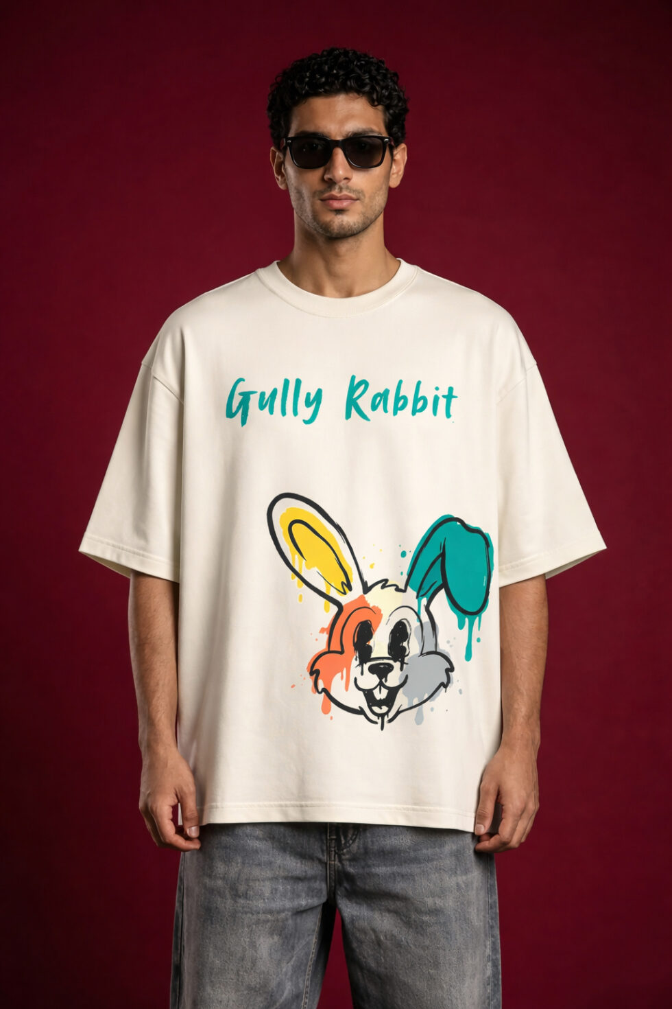 Front view of man wearing Gully Rabbit off-white oversized graphic t-shirt with drip-art bunny