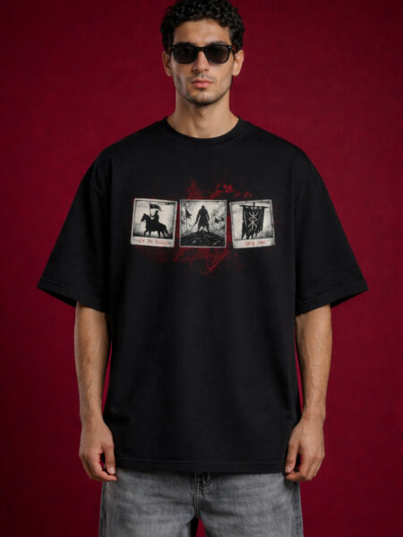 Front view of a man wearing a black heavyweight oversized t-shirt featuring three vintage polaroid-style warrior graphics on the chest with red blood-splatter accents.