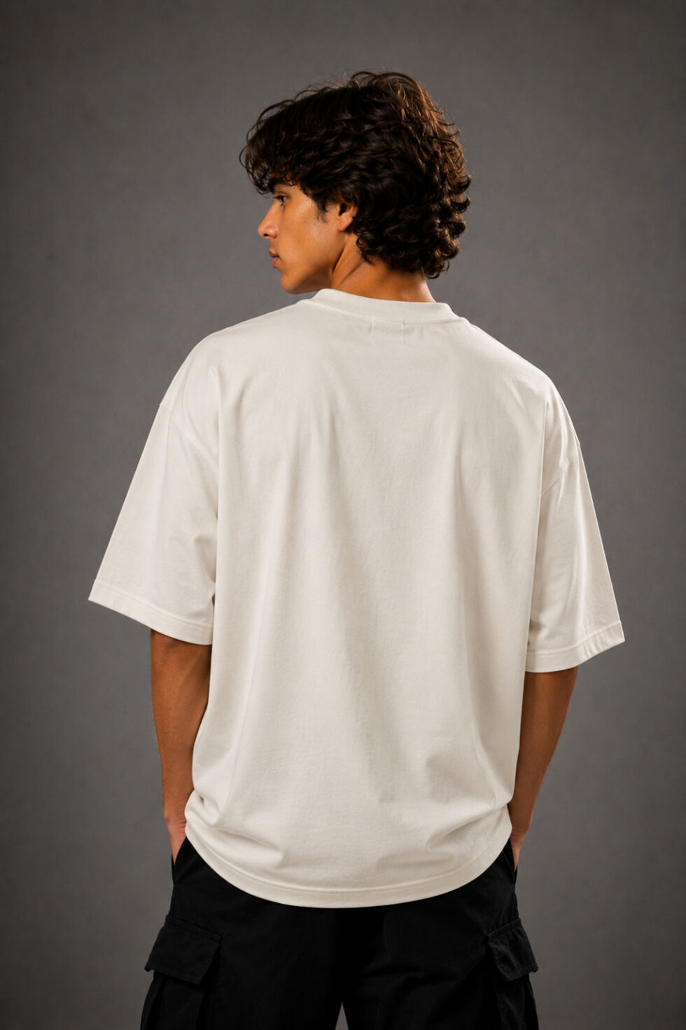 MOS oversized off-white t-shirt featuring pink watercolor tulip floral graphic print on premium cotton fabric worn by male model