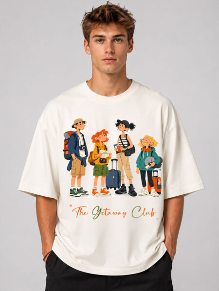 Front view of a man wearing The Getaway Club cream oversized graphic t-shirt featuring a colorful travel-themed character illustration across the chest.