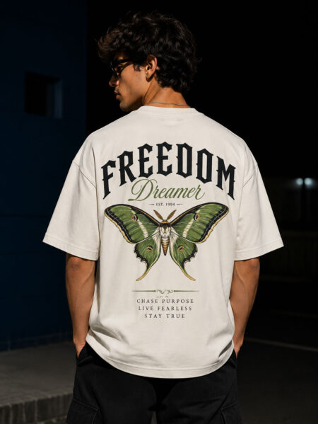 Freedom Dreamer oversized cotton graphic t-shirt for men featuring vintage moth artwork on the back and bold typography on premium off-white oversized streetwear tee