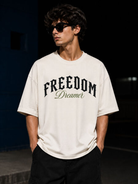 Freedom Dreamer oversized cotton graphic t-shirt for men featuring vintage moth artwork on the back and bold typography on premium off-white oversized streetwear tee